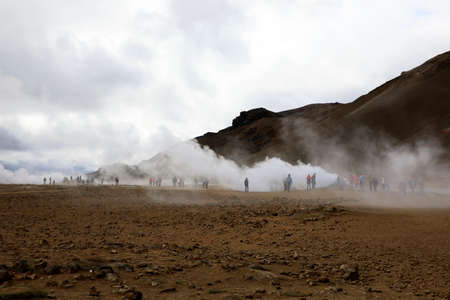 Hverir / Iceland - August 30, 2017: Tourists walking at Hverir geothermal and sulfur area near Namafjall mountain, Myvatn Lake area, Iceland, Europeのeditorial素材