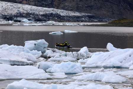Fjallsarlon / Iceland - August 18, 2017: Fjallsarlon Glacier Lagoon view with ice formations,...