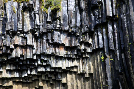 Skaftafell / Iceland - August 18, 2017: The basalt column near the black waterfall of Svartifoss in Skaftafell National Park, Iceland, Europeのeditorial素材
