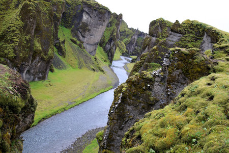 Sudhurland / Iceland - August 15, 2017: River flow through the great canyon of Fjadrargljufur.のeditorial素材