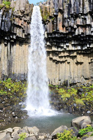 Skaftafell / Iceland - August 18, 2017: The black waterfall of Svartifoss in Skaftafell National...