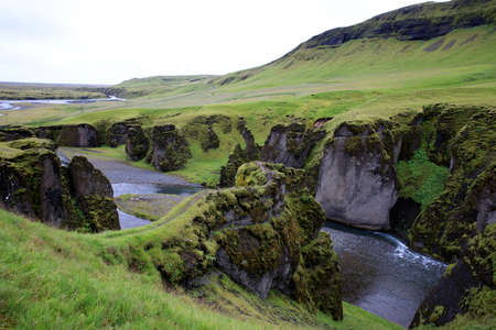 Sudhurland / Iceland - August 15, 2017: River flow through the great canyon of Fjadrargljufur.のeditorial素材