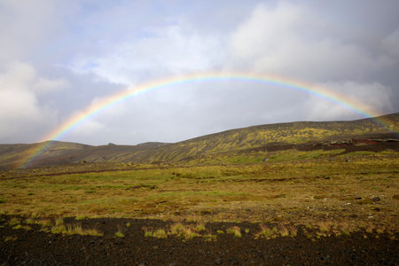 Iceland - August 15, 2017: The spectacullar rainbow arc on a hill near the Ring Road, Iceland, Europeのeditorial素材