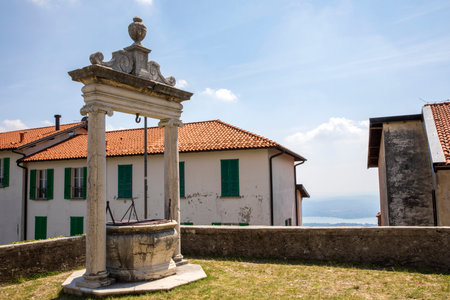 Sacro Monte (VA), Italy - June 01, 2020: Water well at pilgrimage village of Santa Maria del Monte on Sacro Monte di Varese, UNESCO World Cultural Heritage Site, Santa Maria del Monte, Varese, Lombardy, Italyのeditorial素材