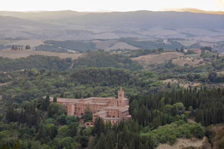 Chiusure, Asciano (SI), Italy - August 15, 2021: Landscape view from Chiusure village and Monteoliveto Maggiore Abbey, Asciano, Tuscany, Italyのeditorial素材