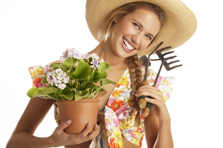 young woman gardener on white backgroundの写真素材