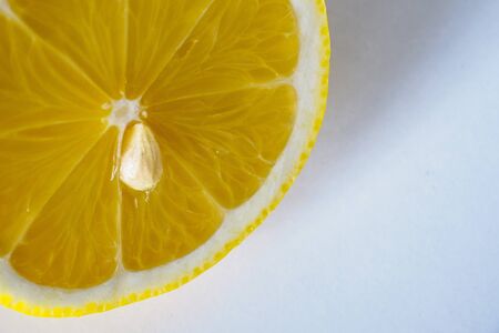 Portion of a slice of lemon isolated on white background. Landscape format. Close-up.の写真素材