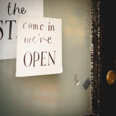 Open sign on a window shop . Landscape format.の写真素材