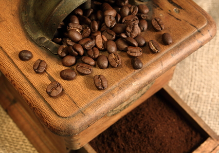 Old grinder with coffee beansの写真素材