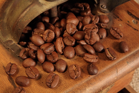 Old grinder with coffee beansの写真素材