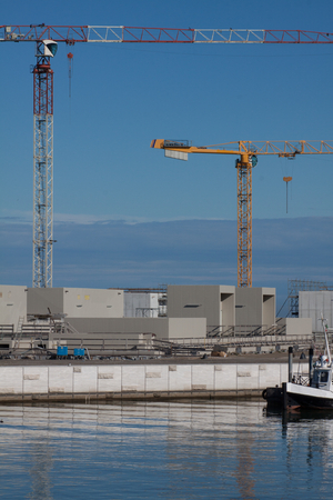 Construction site with cranes in a seaportの写真素材