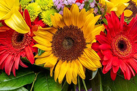 Bright flower bouquet with sunflowers. Nature background.の写真素材