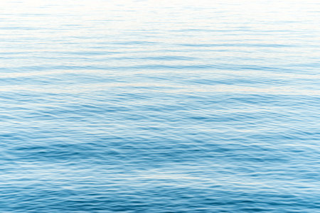 Blue sea water surface with calm waves.の写真素材