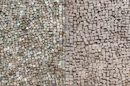 Old stone tiles mosaic on the wall.