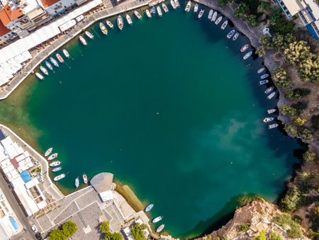 Aerial top view by drone of Voulismeni Lake in Agios Nikolaos city. Greece, Crete.の写真素材