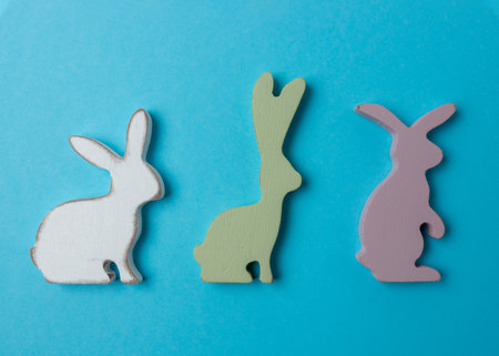 Easter bunnies decoration on blue background. Minimal Easter concept.の写真素材