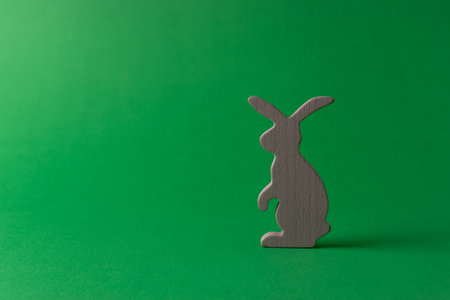 Easter bunny decoration on green background. Minimal Easter concept.の写真素材