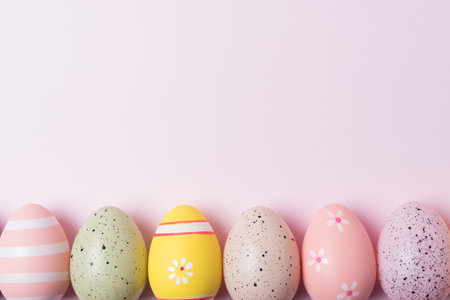 Colorful Easter eggs on pink background. Minimal Easter concept. Flat lay.