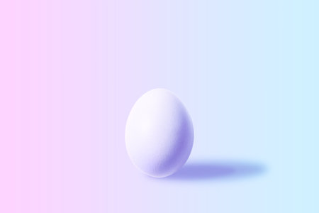 White Easter egg with colorful ultraviolet holographic neon lights. Creative concept.の写真素材