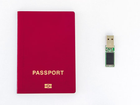 Usb flash drive and passport on a white background.