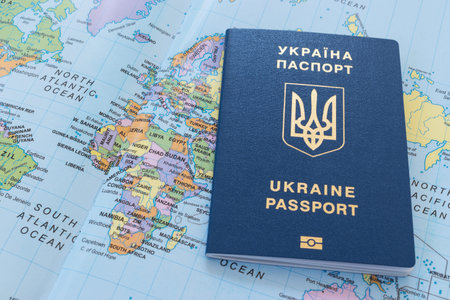 Ukrainian travel passport on a world map