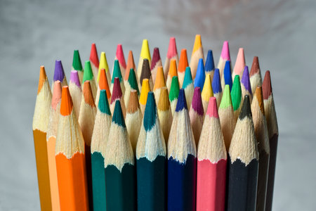 Collection of colored pencils on silver background.の写真素材