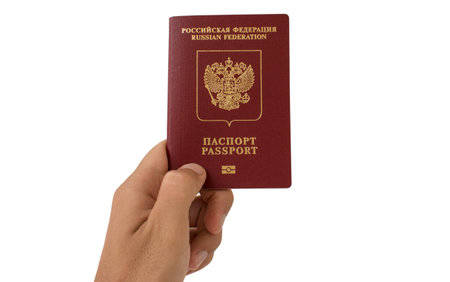 Russian foreign passport in the hand isolated on white backgroundの写真素材