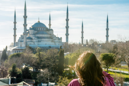 Young woman looking at amazing Blue Mosque in Istanbul, Turkey.の写真素材