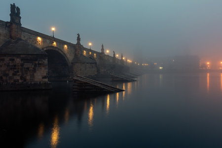View of the Charles Bridge in Prague at the sunrise with mystical fog. Czech Republic.の写真素材