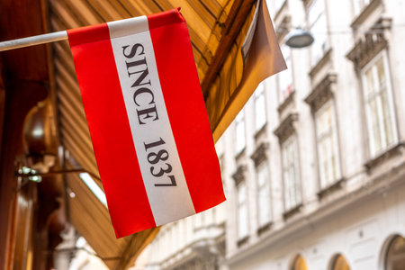 Austria flag on the street on background of Vienna city.の写真素材