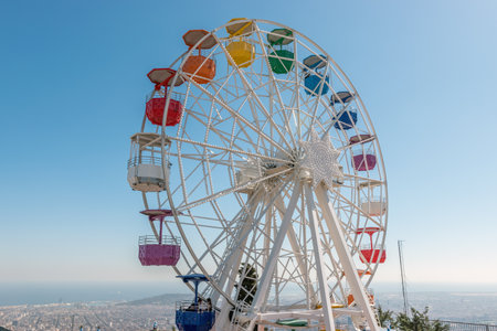 Old colorful ferris wheel on background of blue sky.の写真素材
