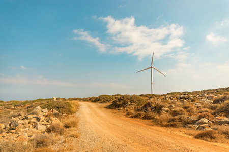 Wind turbines on beautiful sunny mountain landsape. Green power generation concept.の写真素材