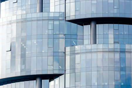 Background with modern glass and steel office building.の写真素材