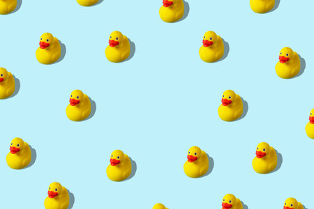 Creative pattern with rubber duck on blue background. Minimal summer concept.の写真素材