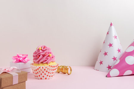 Colorful celebration background with various party decorations and cupcake. Minimal party concept.の写真素材