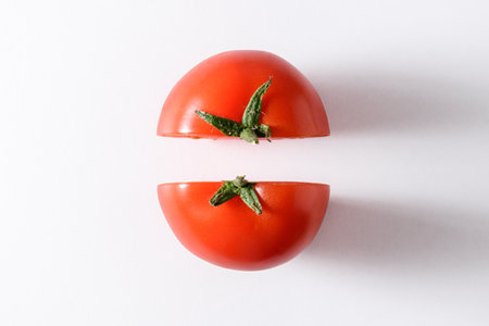 Half fresh tomatoes on white background. Food concept.の写真素材