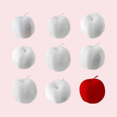 White apples with red apple on pink pastel background. Minimal style. Food concept.の写真素材