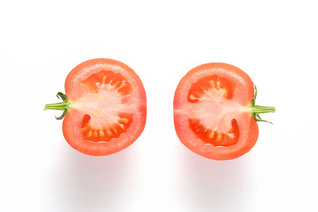 Half fresh tomato isolated on white background. Top view.の写真素材