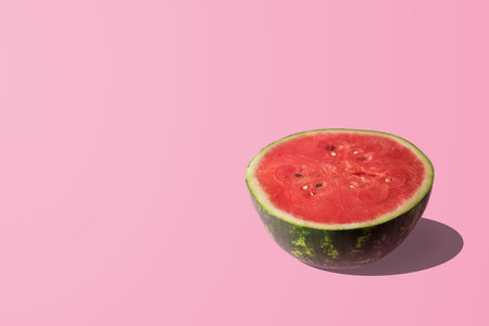 Sliced watermelon on pastel pink background. Minimal fruit concept.の写真素材