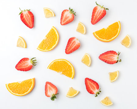 Colorful pattern made of citrus fruits and strawberries. Minimal summer concept.の写真素材