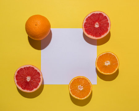 Creative fruit composition on yellow background with hard shadows. Summer minimal concept.の写真素材