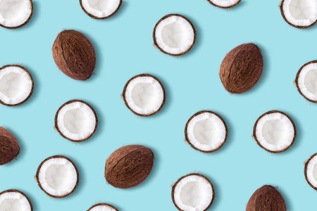 Coconut fruit on a pastel blue background. Minimal summer concept. Flat lay.の写真素材