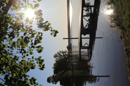 A view of a bridge on the river in the evening sun.の写真素材
