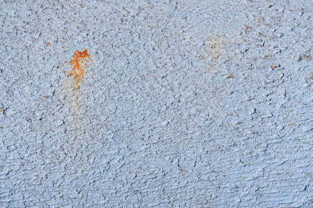 Abstract building texture cement white gray stain separate orange rust and background with copy space.