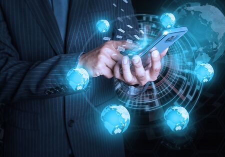 Businessman hold mobile phone social and internet connectivity conceptの写真素材