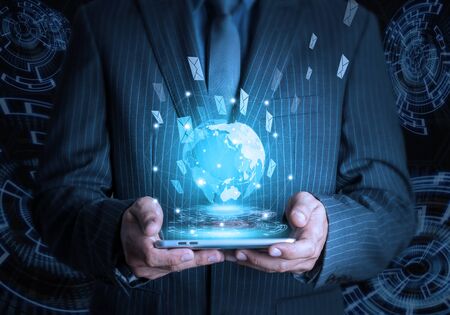 Businessman hold smart phone social and internet connectivity conceptの写真素材
