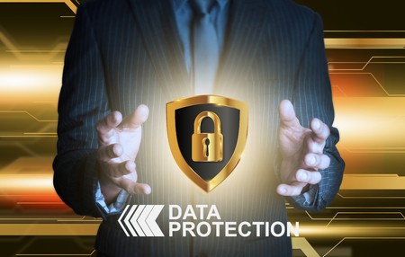 Businessman holding data protection shieldの写真素材