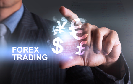 Holding world of currency forex trading with 2 fingerの写真素材
