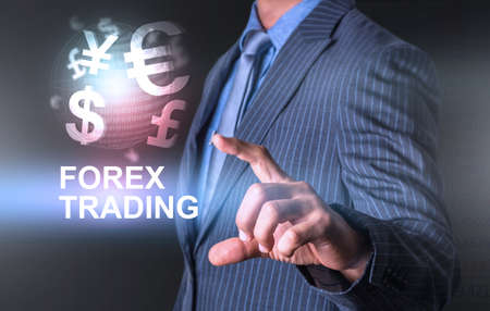 Holding world of currency forex trading with one handの写真素材
