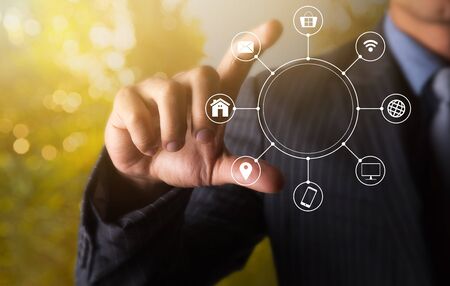 Holding multichannel online communication network with 2 fingerの写真素材